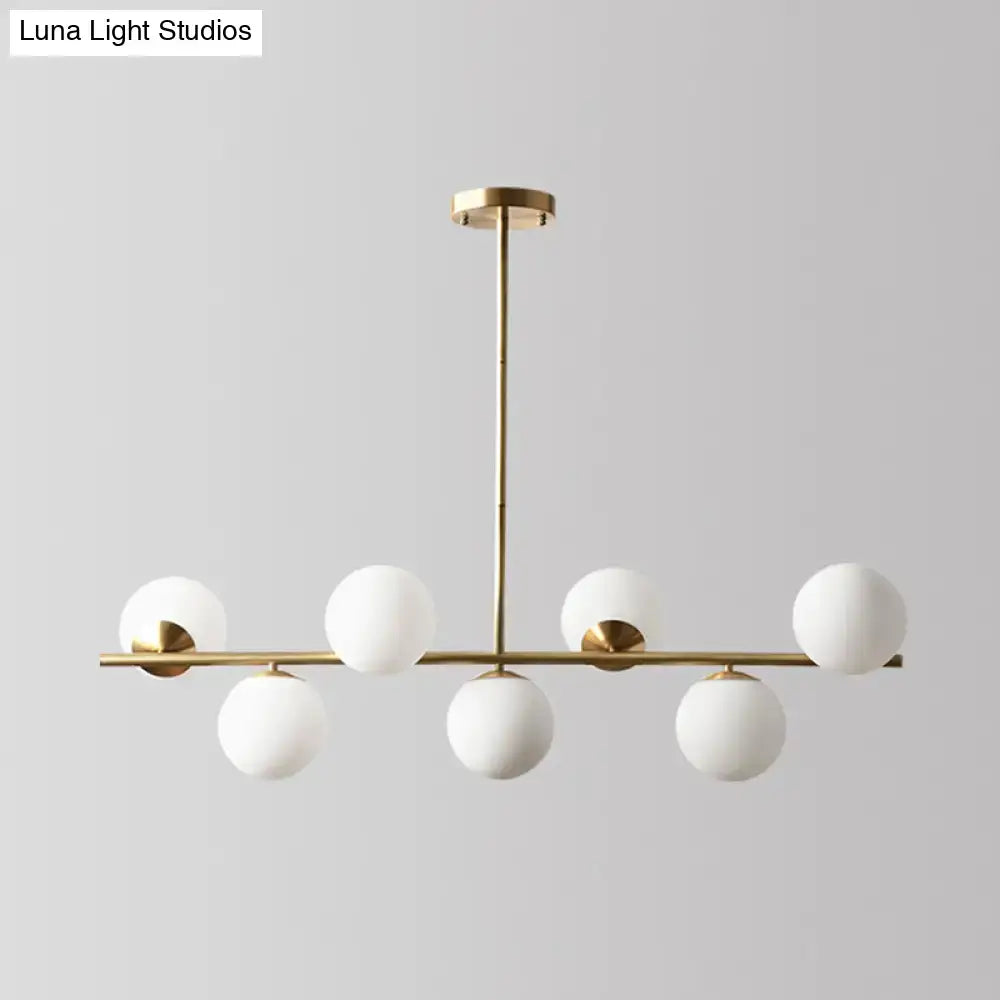 Decorbites sleek cream glass spherical dining room pendant light with gold-toned modern chandelier and six globes