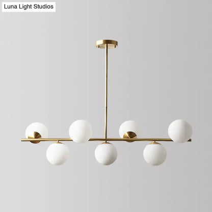 Decorbites sleek cream glass spherical dining room pendant light with gold-toned modern chandelier and six globes