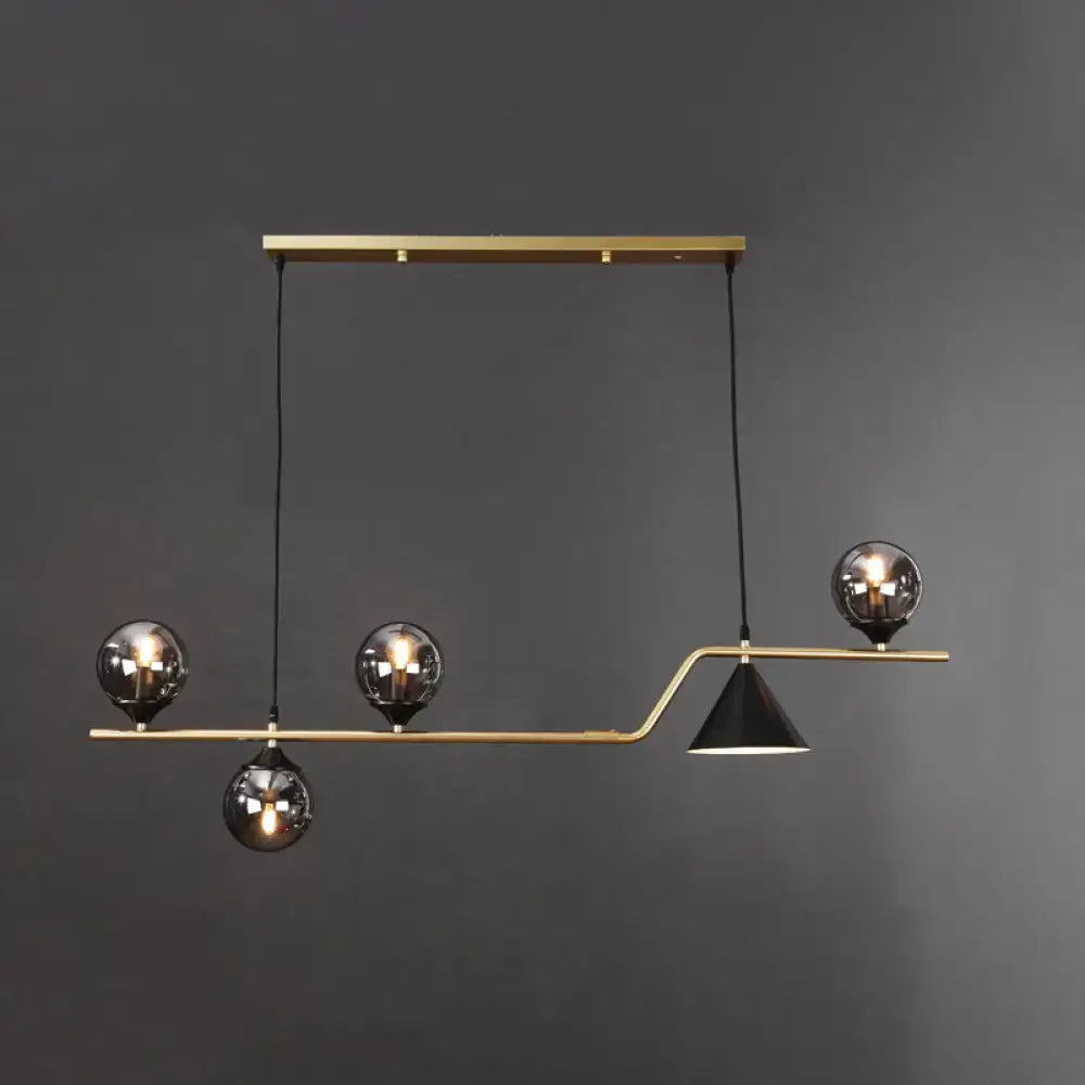 Modern brass DecorBites minimalist ball hanging island light with three smoked glass globes and black conical shade for dining room