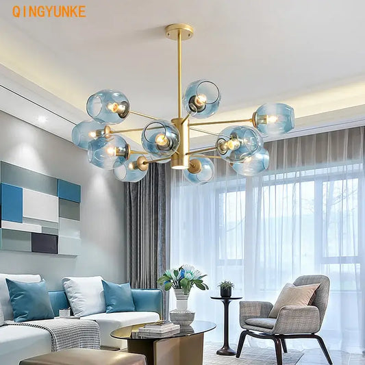 Modern brass iron ball chandeliers with multiple translucent blue glass globes for dining room lighting