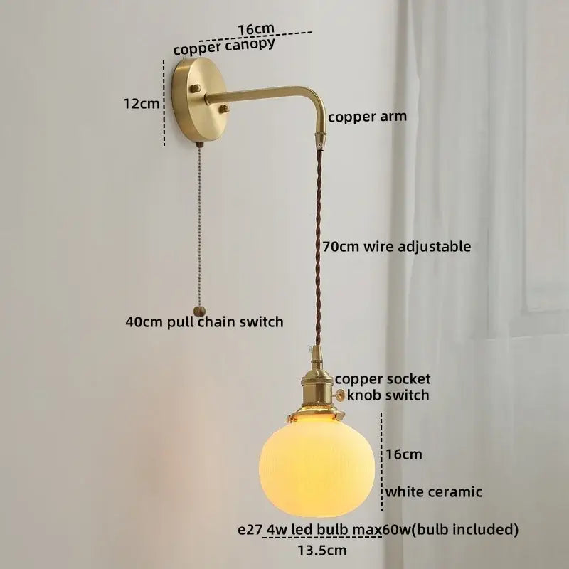 Modern brass and ceramic copper led wall lamp with a glowing white ceramic globe and adjustable 70cm wire by decorbites