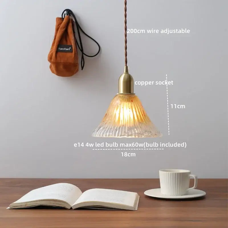 Modern brass and clear glass chandelier pendant light with warm-toned ribbed glass and adjustable wire for dining room