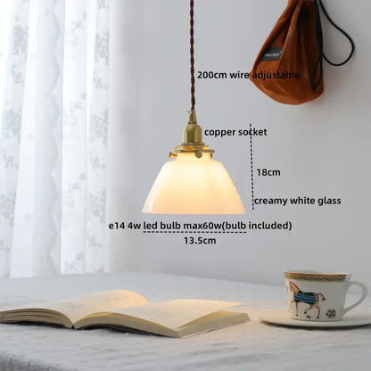 Modern brass and clear glass chandelier pendant light with creamy white shade and braided brown wire for dining room