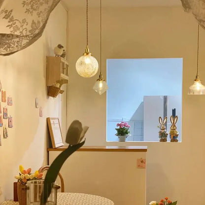Modern brass and clear glass led pendant light with warm-toned decorbites clear glass for dining room lighting