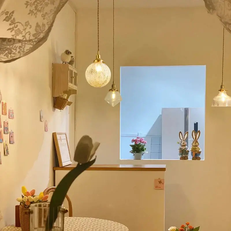 Modern brass and clear glass led pendant light with warm-toned decorbites clear glass for dining room lighting