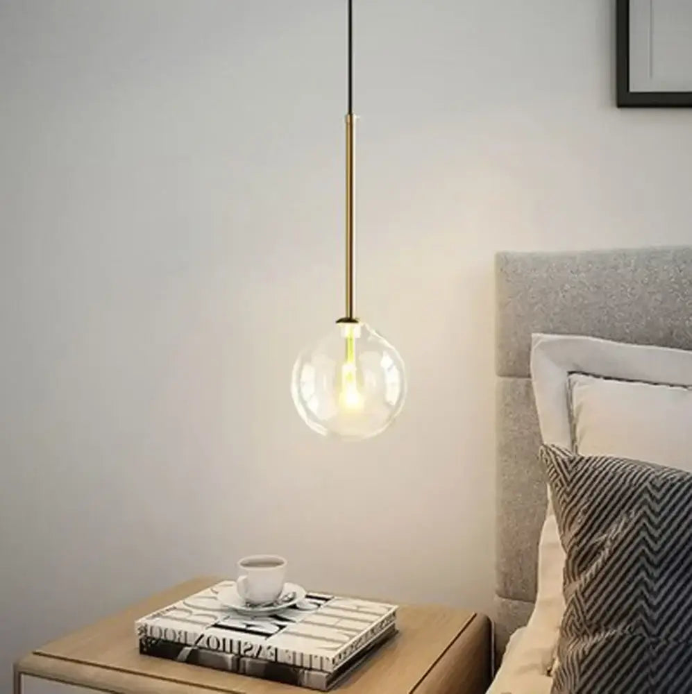 Modern brass and clear glass pendant light with a clear glass chandelier globe for dining room decorbites pendant light