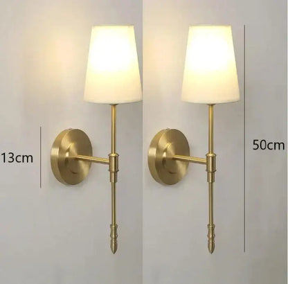 Modern brass and cream fabric led wall lamps featuring a brass-finished wall sconce with cream fabric shade for bedroom lighting