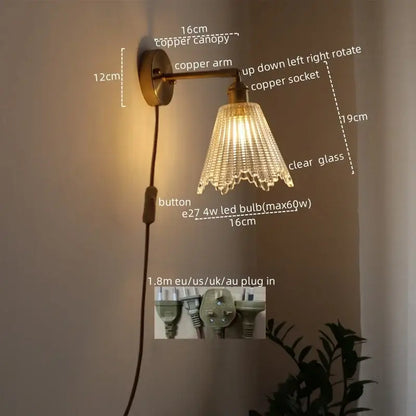 Copper-finished modern brass and crystal led wall lamp with clear glass shade and cascading crystal prisms for bedroom use