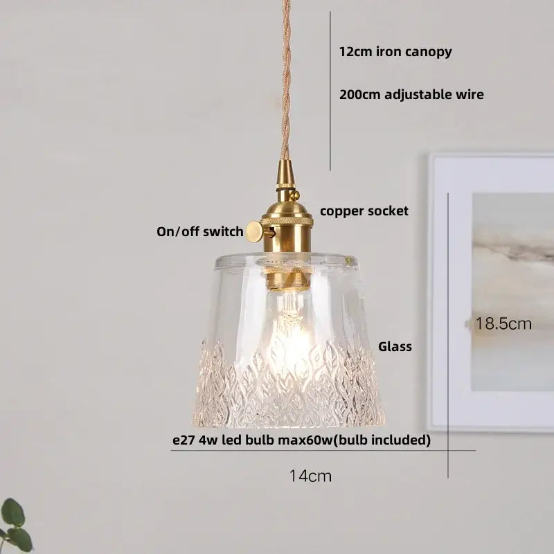 Modern brass and cut glass led pendant light featuring a clear glass textured leaf-patterned base with brass finish