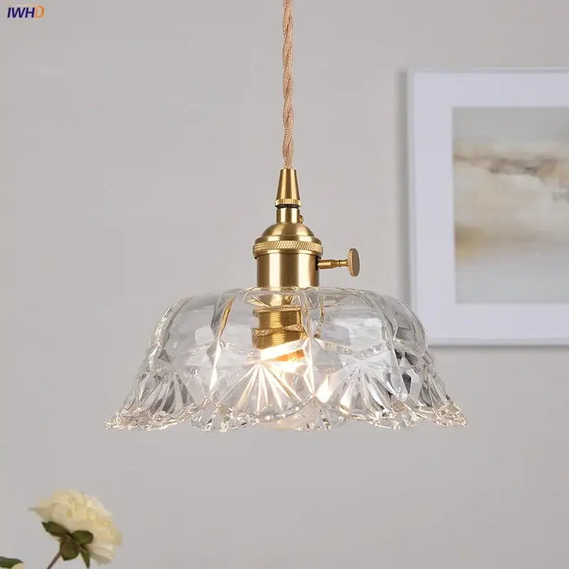 Modern brass and cut glass led pendant light with clear intricately cut glass and edison-style bulb for dining room