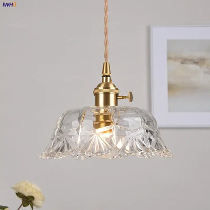 Modern brass and cut glass led pendant light with clear intricately cut glass and edison-style bulb for dining room