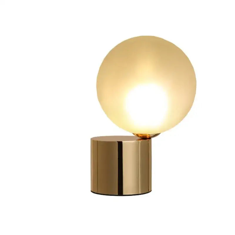Modern brass table lamp with decorbites glass circular frosted globe shade for bedroom lighting