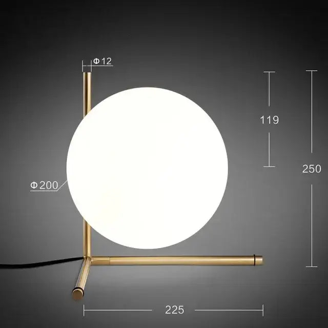 A modern brass pendant light with a frosted glass ball shade ideal as a decorbites light fixture for dining rooms