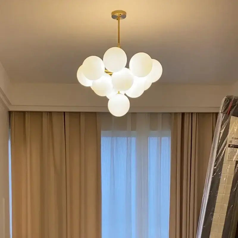 Modern brass and frosted glass chandelier with multiple spheres for living room decorbites elegant glass chandelier