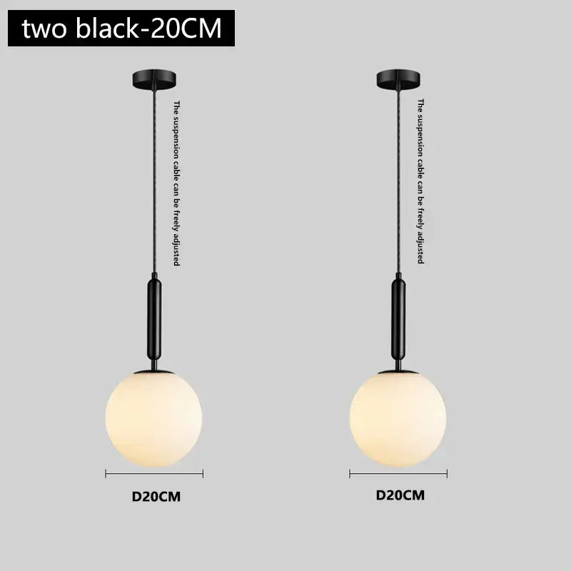 Modern brass and frosted glass pendant light featuring black spherical frosted glass chandelier pendant lights with adjustable cables