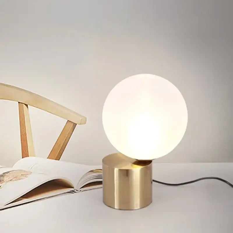 Modern brass and glass ball table lamp with frosted white glass globe and brushed brass base for bedroom bedside decorbites glass ball
