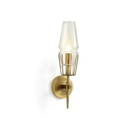 Modern brass and glass bedside table lamp wall sconce with clear glass shade and wire cage design for bedroom use