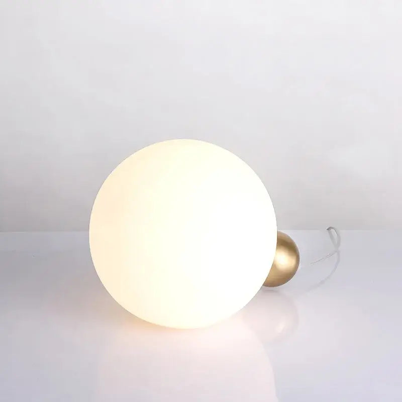 Modern brass and glass decorbites glass desk lamp with frosted white spherical shade for bedroom use