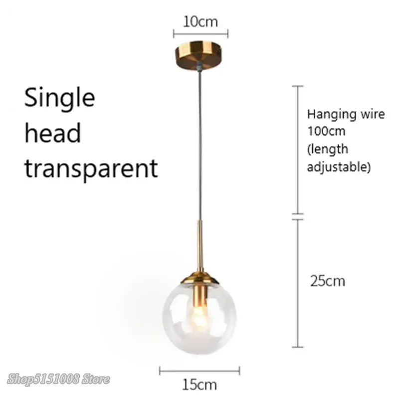 Modern brass and glass pendant lights featuring a transparent glass pendant with gold-toned fixture and adjustable wire