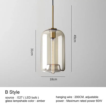 Modern brass and glass pendant lights feature amber-tinted glass and exposed Edison bulb for kitchen and dining rooms