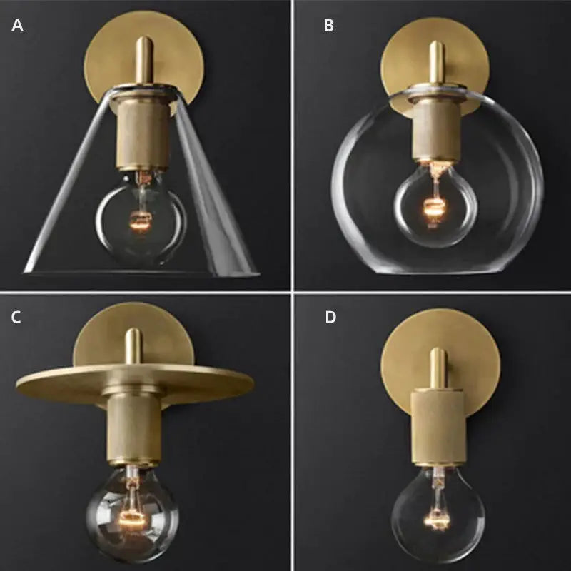 Modern brass and glass wall sconce with clear glass shades and exposed filament bulbs for bedroom lighting