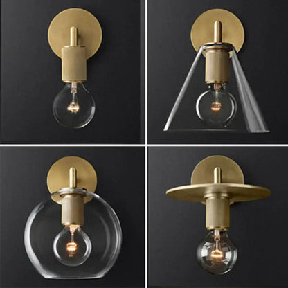 Modern brass and glass wall sconce featuring brass finish with clear glass shades and exposed bulb design for bedroom lighting
