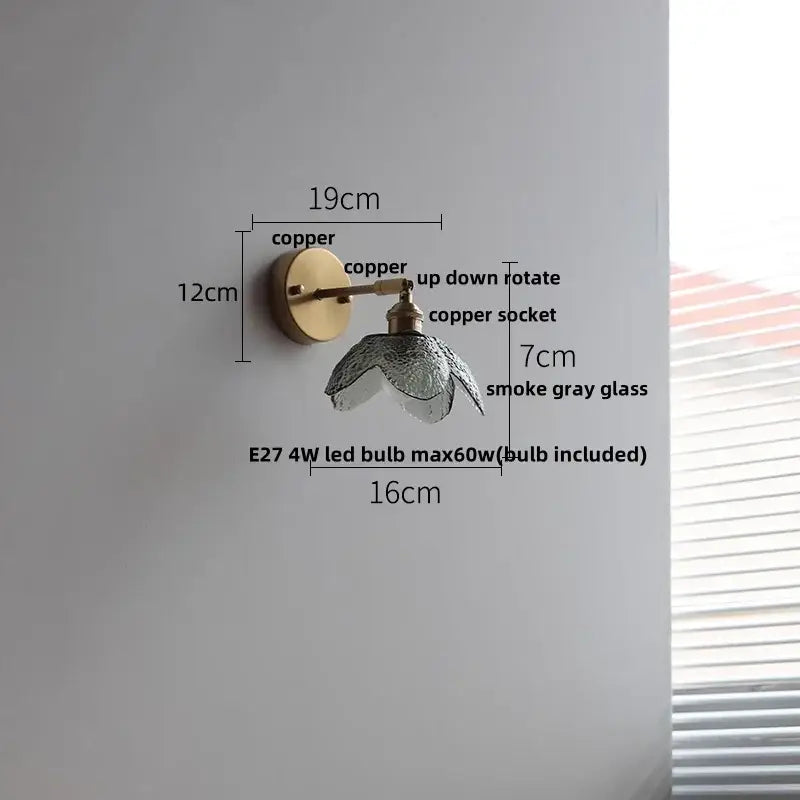 Modern brass and gray glass led wall sconce with copper finish and smoke gray glass shade for bedroom lighting