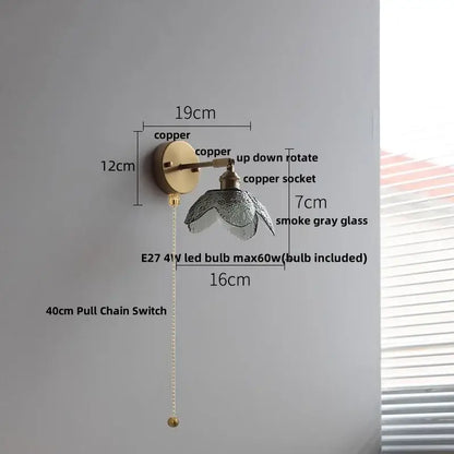 Modern brass and gray glass led wall sconce with a copper frame textured smoke gray glass shade and 40cm pull chain switch