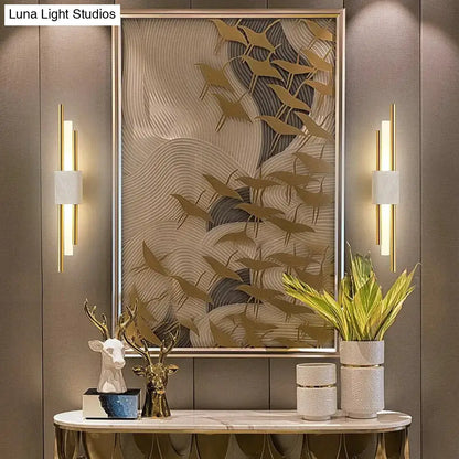 Modern brass and green marble led wall lamp with gold-toned sculptural wave art and bird silhouettes for living room
