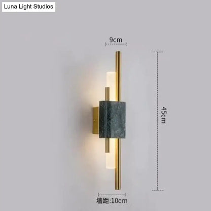 Modern brass and green marble led wall lamp with brushed gold frame dark gray marble accent and frosted glass diffuser