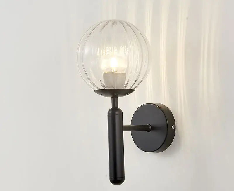 Modern brass and black metal wall sconce with ribbed glass globe for bedroom decorbites blue glass balls style