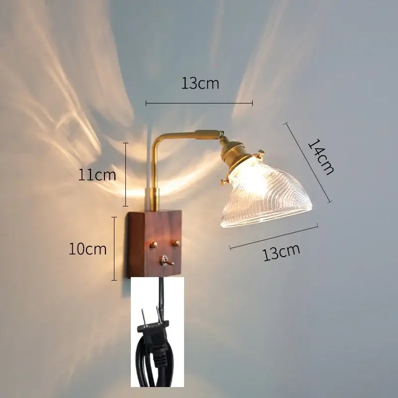 Modern brass wall lights featuring a textured clear glass shade perfect for bedroom decorbites clear glass sconce