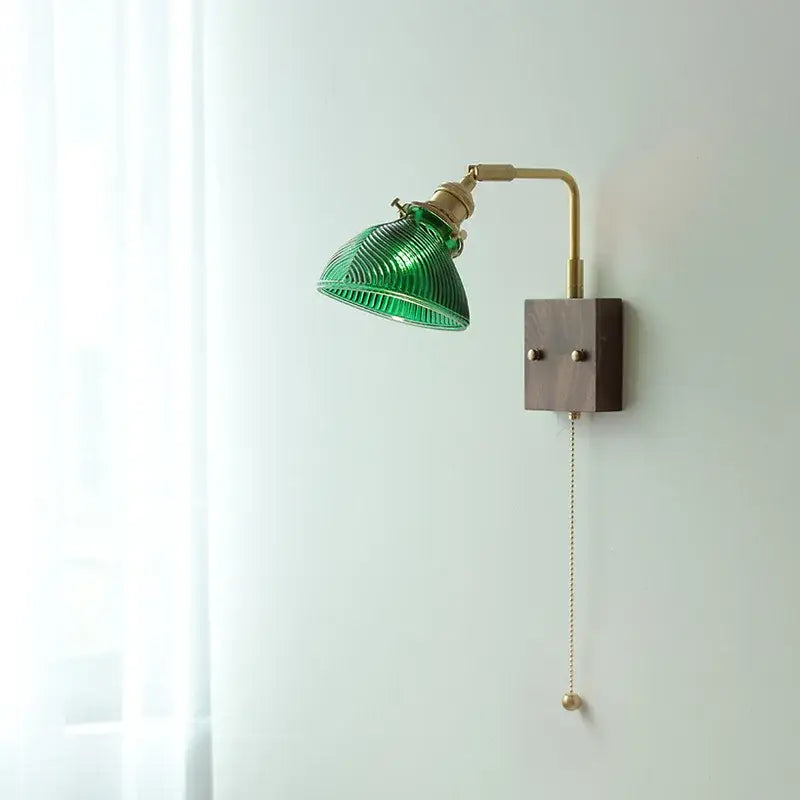 Modern wall lights featuring green ribbed clear glass with brass accents and a wooden base for elegant decorbites clear glass decor
