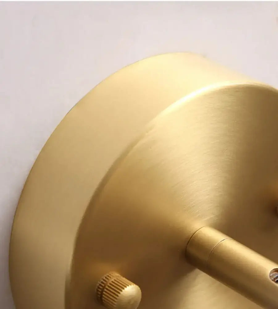 Modern brass and walnut led wall sconce with brass finish and adjustable arm for bedroom spotlight lighting