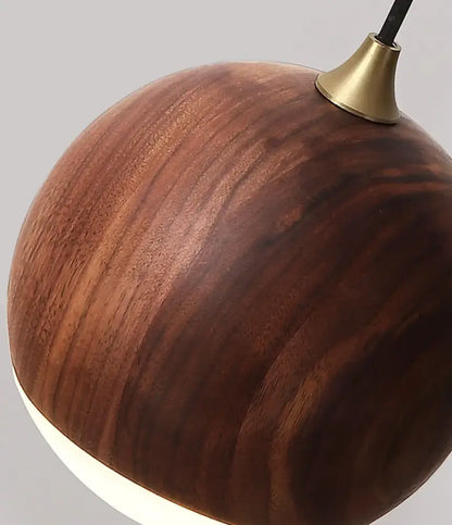A modern brass and walnut wood wall sconce with a sleek round pendant light and warm brown finish for bedroom decorbites adjustable walnut