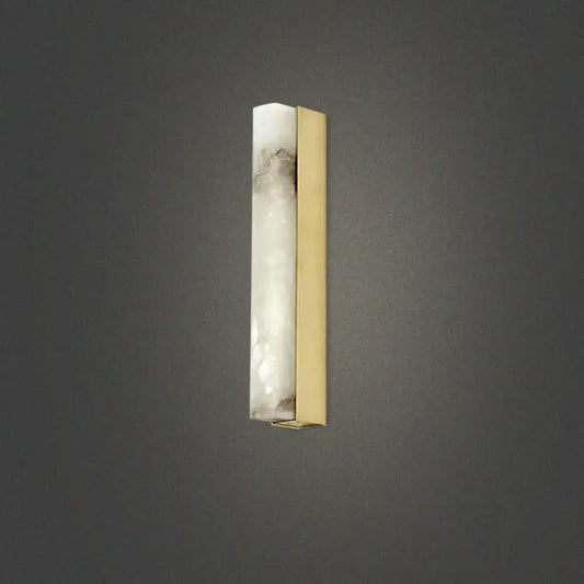 A modern brass and white onyx wall lighting sconce with translucent onyx and polished brass for living room use