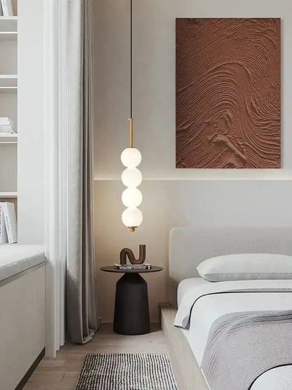 A modern brass pendant light with three spherical led white pearl bulbs for kitchen decorbites led white hanging lamp