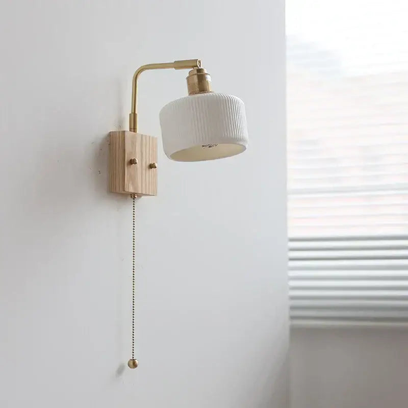 Modern brass and wood ceramic led wall sconce with white ribbed ceramic shade and brass arm for bedroom vanity decorbites ceramic led