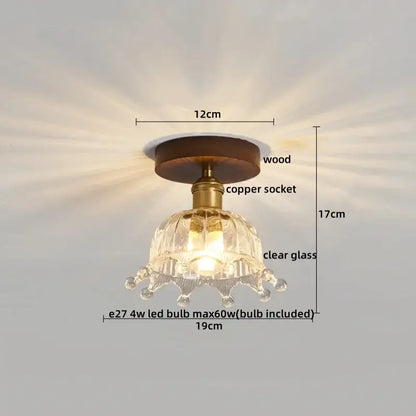 A modern brass and wood led ceiling light with frosted glass and a clear glass chandelier featuring a wooden base decorbites led ceiling