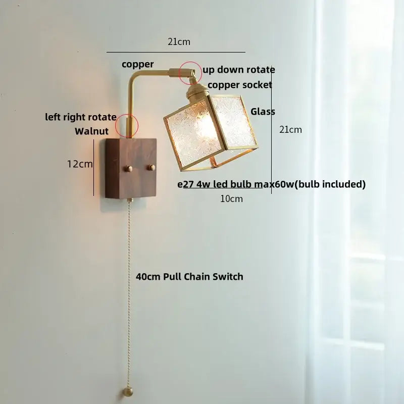 Modern brass and wood led wall lights with a brass copper arm and frosted glass cube for bedroom lighting