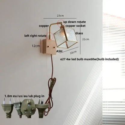 Copper-finished wall lights with geometric blue glass shade and adjustable arm featuring led technology for bedroom use