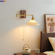 Modern brass and wood wall light with ribbed translucent glass shade ideal for bedroom reading and decorbites ceramic copper
