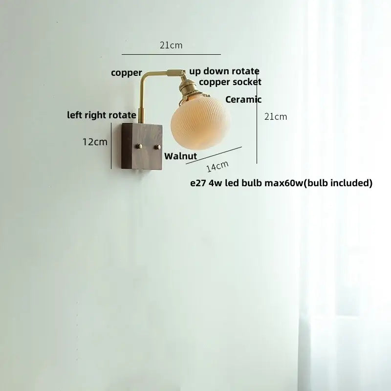 Modern copper-finished wall light fixture with ribbed ceramic globe and walnut mounting plate for bedroom use