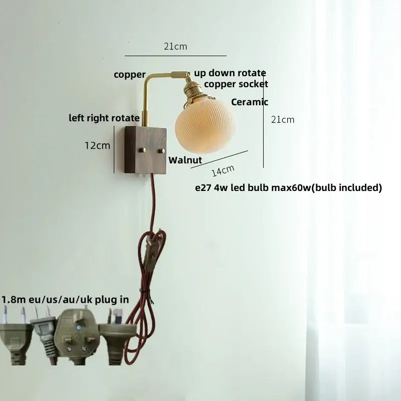 Adjustable copper wall light fixture with ceramic globe shade and walnut-finished mounting plate for bedroom use