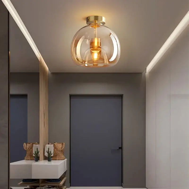 Modern brass and black glass ball led ceiling light with warm ambient glow for living room decorbites glass ball decor
