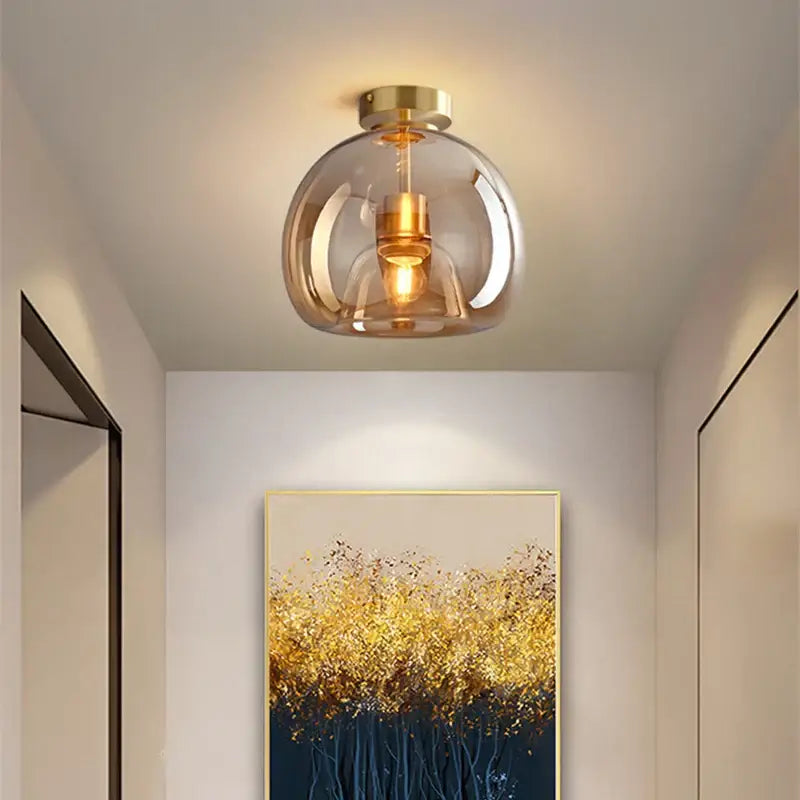 Modern brass and black glass ball led ceiling light with a spherical smoked glass globe for living room decorbites ceiling light