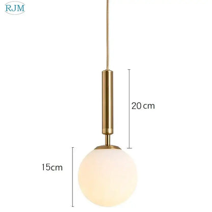 Modern brass and black decorbites glass ball led pendant light with gold-toned stem and frosted glass globe for dining room