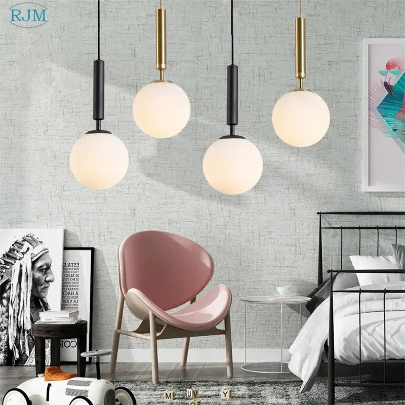 Three modern pendant lights with matte black and brass glass ball LED globe shades for dining room decorbites pendant light