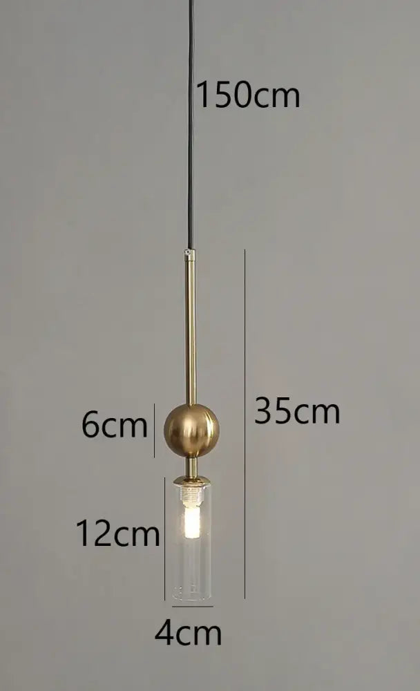 Modern brass and black glass pendant light with cylindrical shade and led bulb suspended by a cord pendant