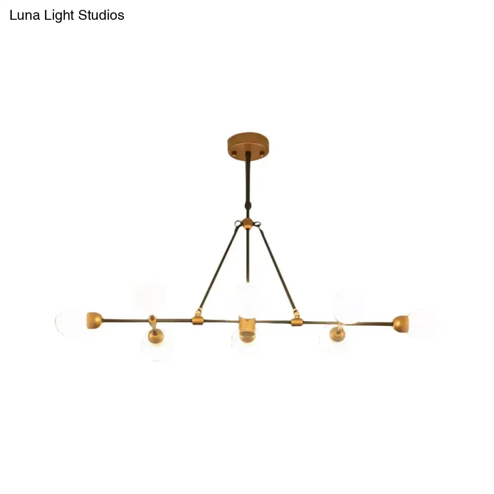 Decorbites brass finish island light with orb shade featuring clear glass globes and black metal for dining room use